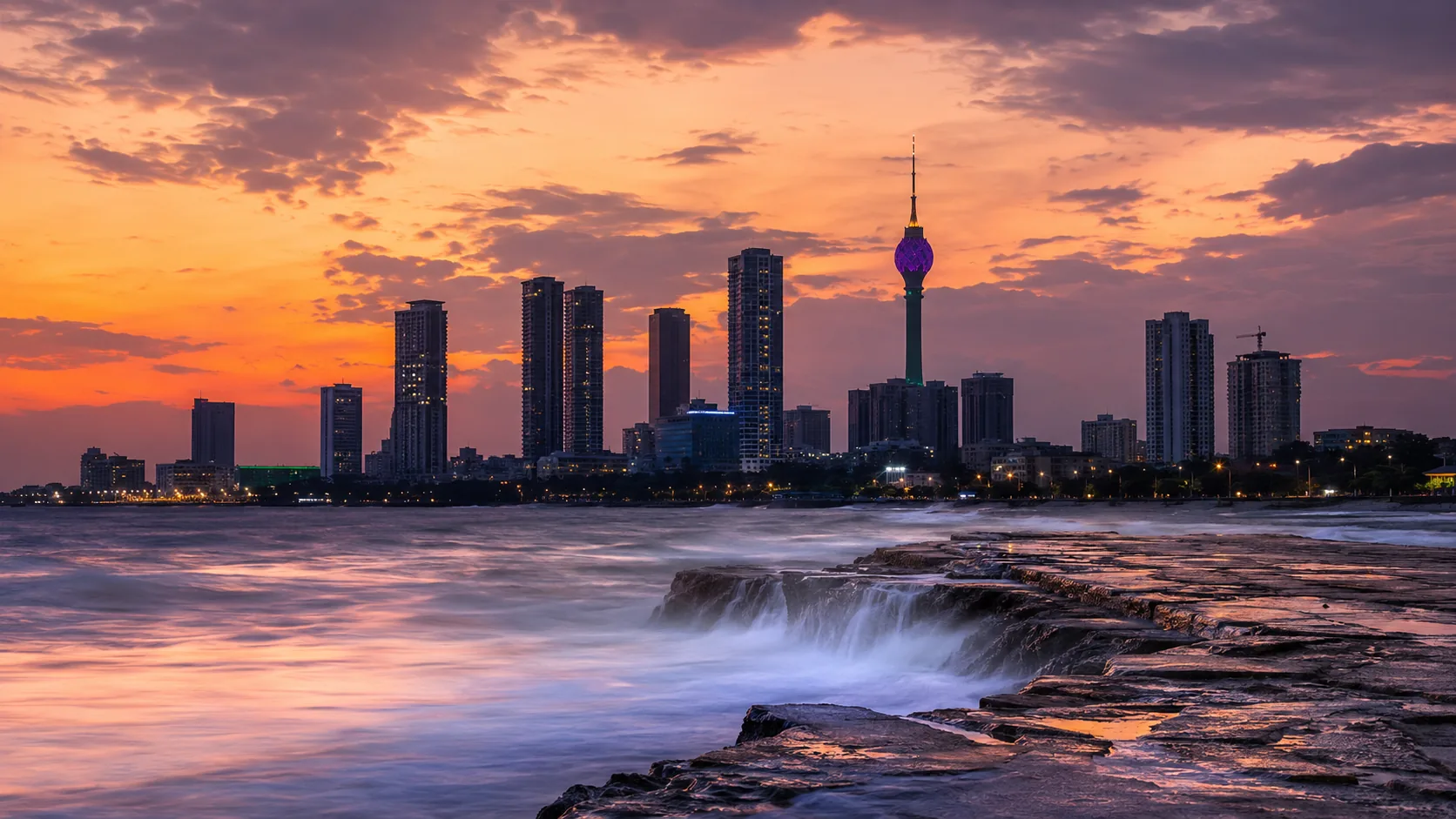 Colombo skyline with the Lotus Tower at dusk from the Galle Face seafront